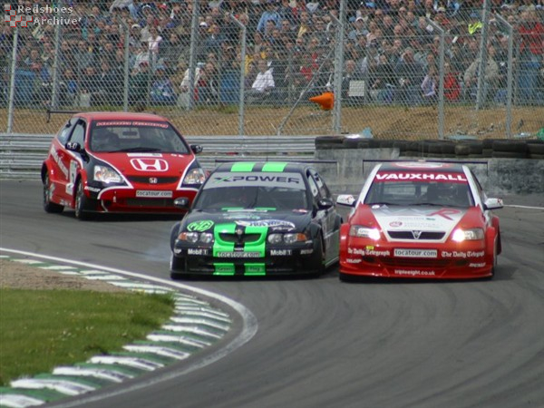 Muller and Hughes dispute the corner